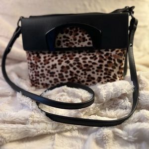 Christian Louboutin handbag in textured leopard print and black leather